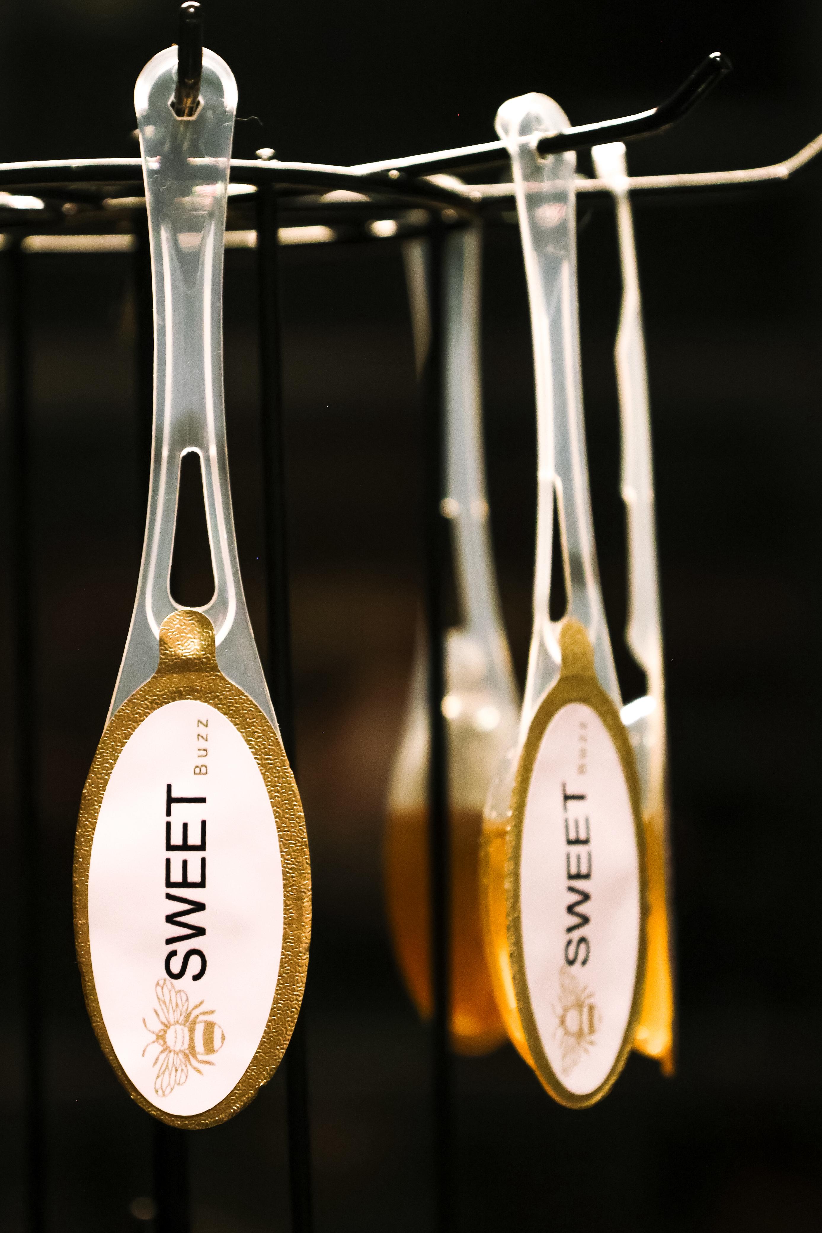 Sweet Buzz honey spoons close-up
